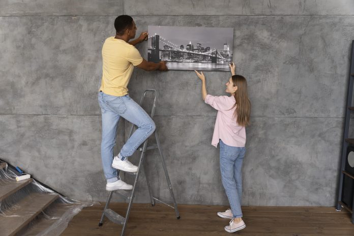 close-up-people-making-home-comfortable pay for college through the real estate market